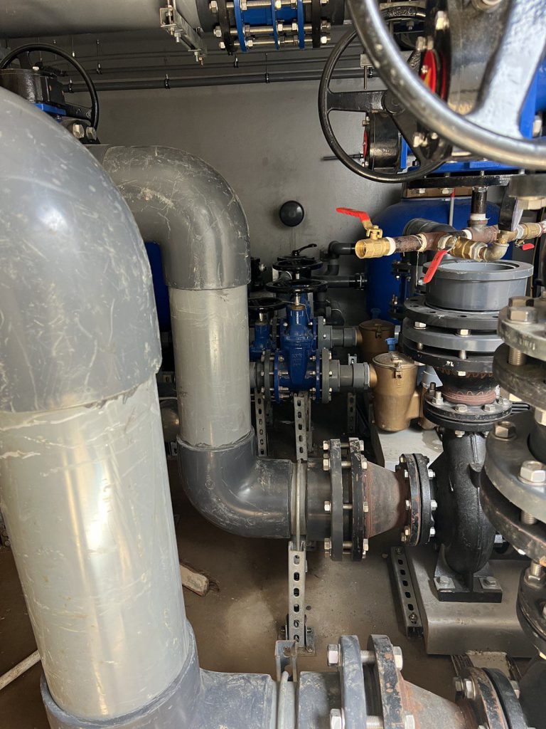 Flanged pipework and valves in a plant room