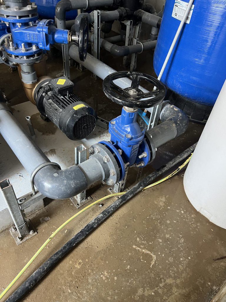 Pump set and gate valve on a concrete plinth